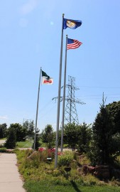 arboretum in summer, flags on their poles at the OPPD Arboretum