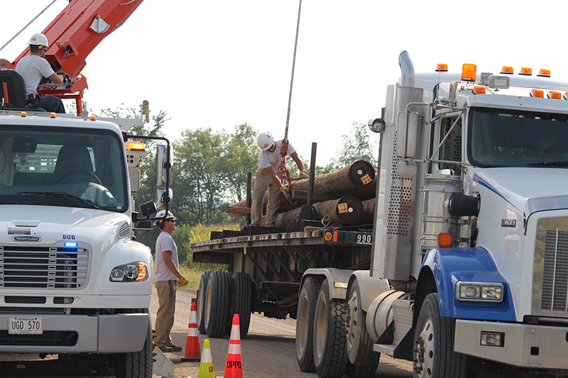 T&D_Apprentice Wrap Job_unload poles 2