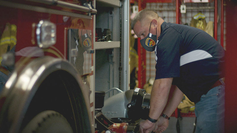 An OPPD employee checks his volunteer firefighter equipment at the fire station. November, 2020 employee firefighters