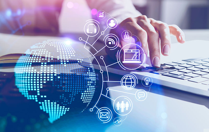 Hands of businesswoman typing on laptop at blurry table with double exposure of futuristic online work interface. Economic development outreach